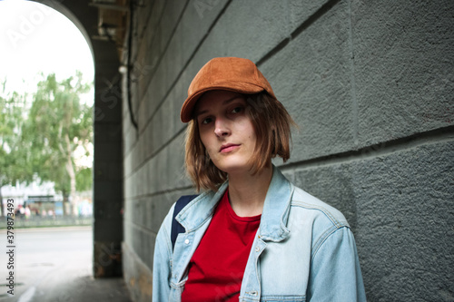 Girl tomboy close up portrait. Street fashion photo