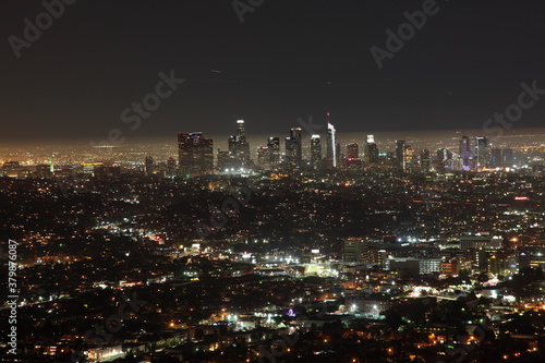 Night view of Downtown Los Angeles skyline seen from Observatory in California, USA