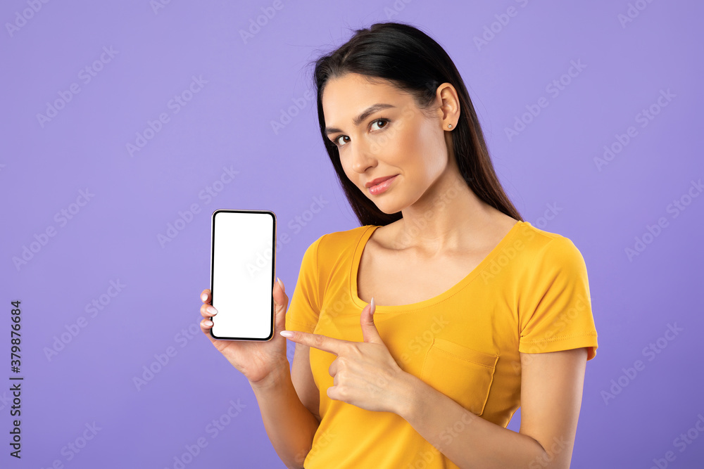 Woman showing white blank cell phone screen Woman showing white blank cell phone screen