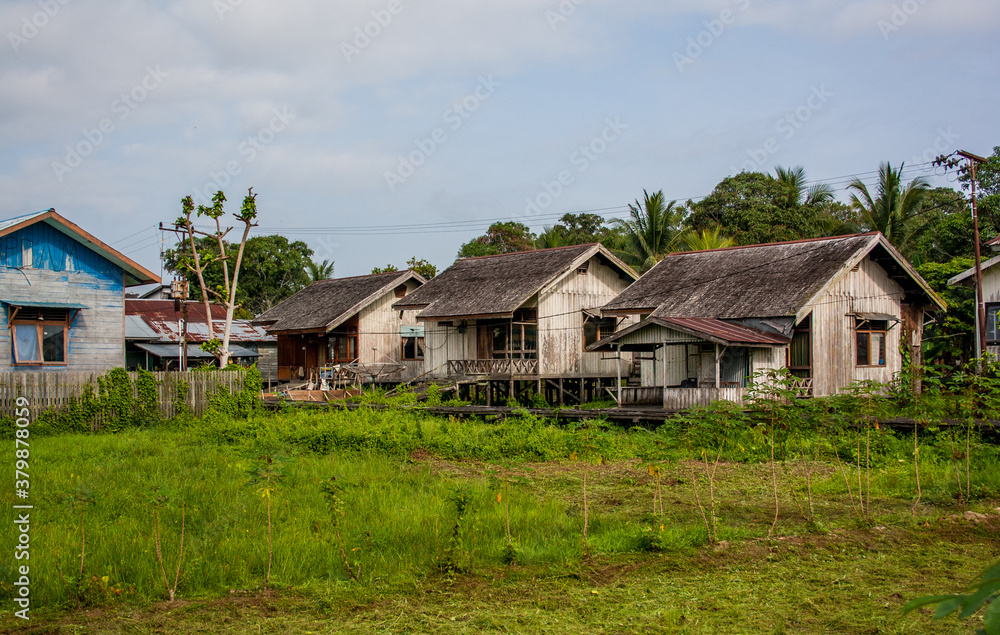 Old wooden houses in the village in the countryside of Borneo island