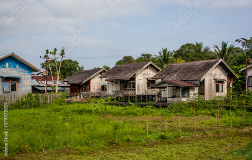 Old wooden houses in the village in the countryside of Borneo island