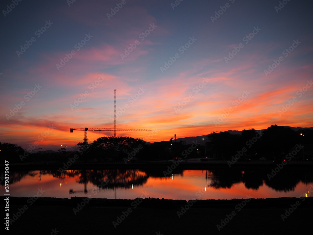 Naklejka premium A construction during the sunset on the mountain