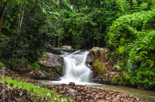 Phu Soi Dao waterfall, in Phu Soi Dao National Park, Thailand. Beautiful scene of waterfall on walkway trekking.