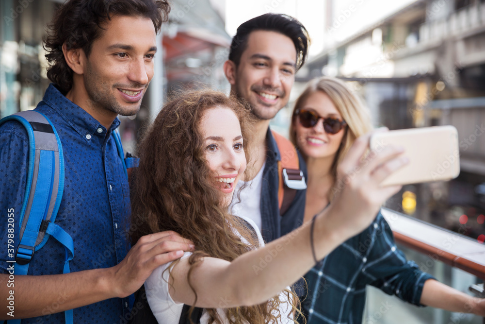 Group of friends talking a selfie together Group of friends talking a selfie together