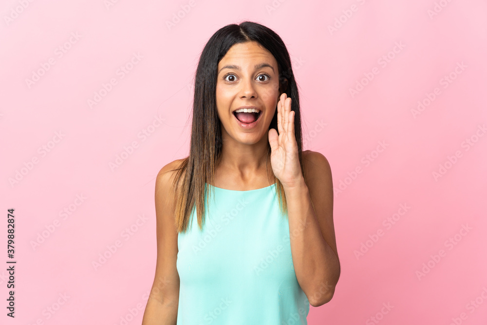 Caucasian girl isolated on pink background with surprise and shocked facial expression Caucasian girl isolated on pink background with surprise and shocked facial expression