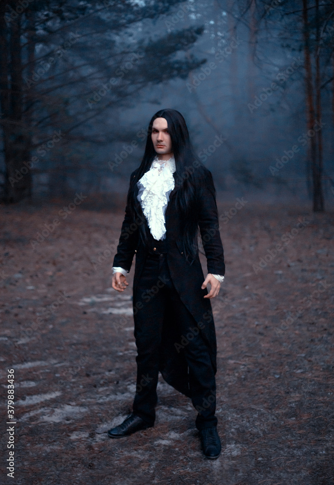 Man in the image of Count Dracula in a black tailcoat. Gothic costume with  white vintage