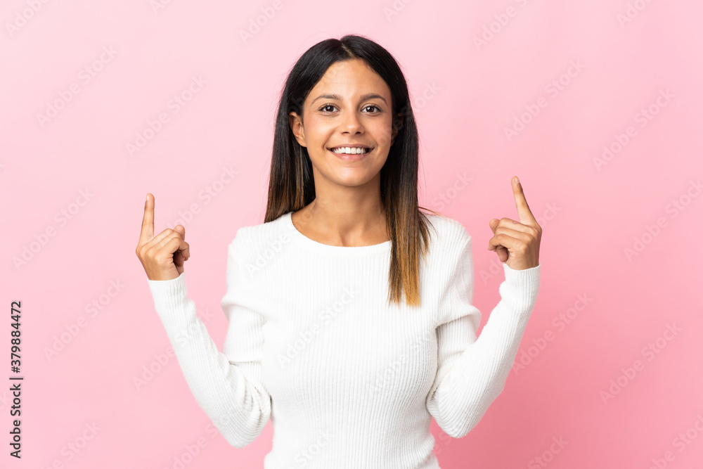 Caucasian girl isolated on pink background pointing up a great idea Caucasian girl isolated on pink background pointing up a great idea