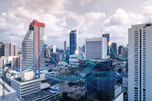 Financial stock chart hologram over panorama city view of Bangkok, business center in Asia. The concept of international transactions. Double exposure.