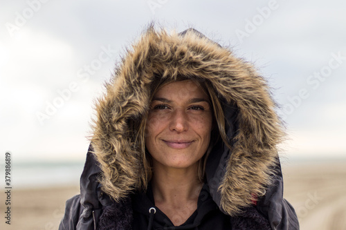 Young woman with hood on head photo