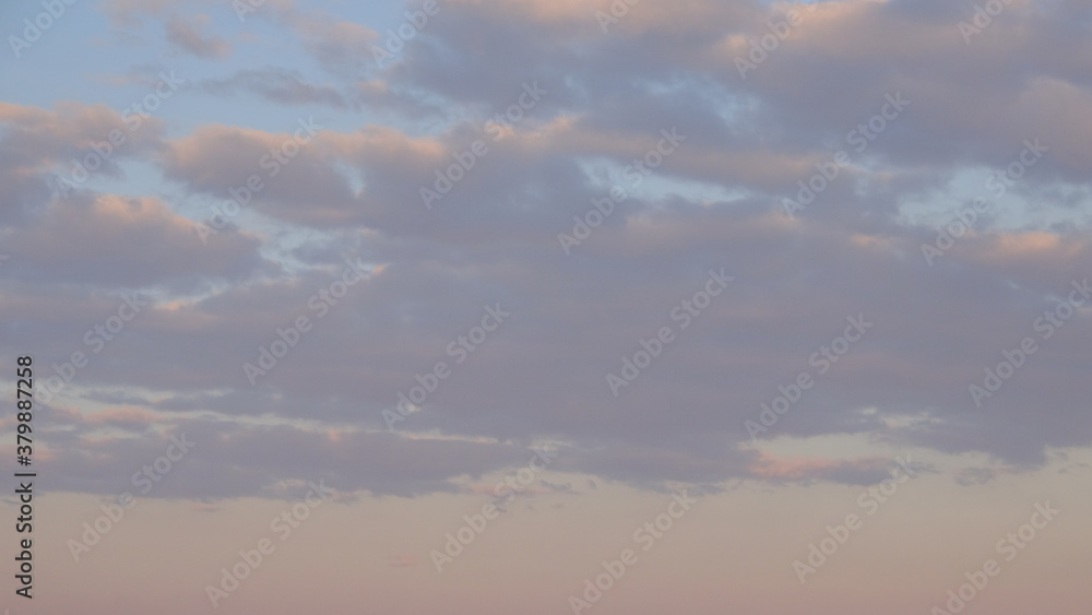 Clouds in the evening sky. Twilight sky as background.