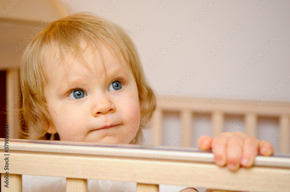 Cute Baby Girl Standing in Crib at Home Cute Baby Girl Standing in Crib at Home