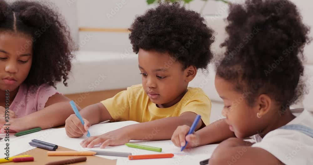 Little boy and girl drawing pictures to paper at home. They learning to draw pictures together. Little boy and girl drawing pictures to paper at home. They learning to draw pictures together.
