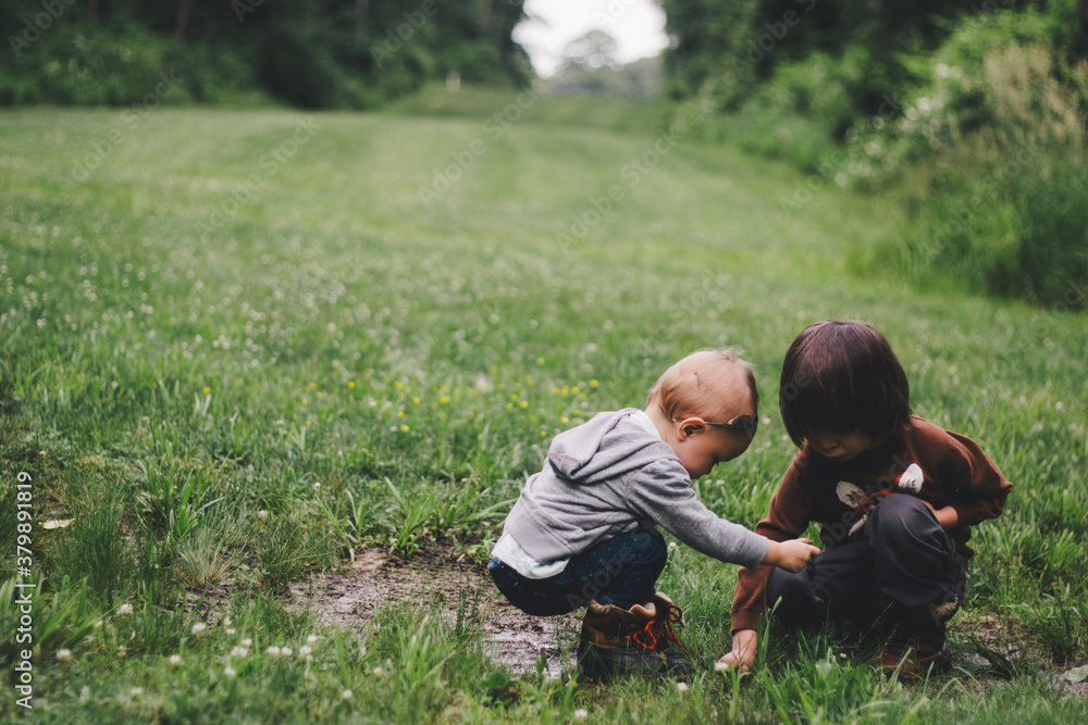 Brother and Sister Outside Playing in the Mud Brother and Sister Outside Playing in the Mud