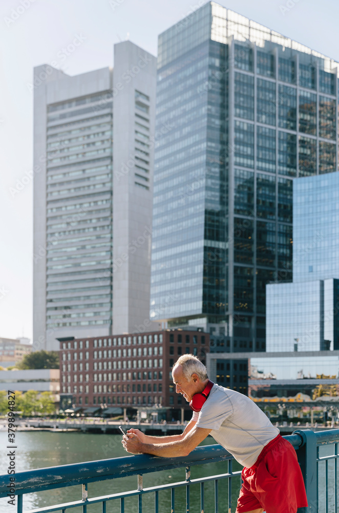 Senior Man on Using Cell Phone in the City Senior Man on Using Cell Phone in the City