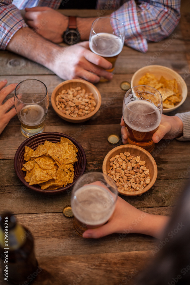Anonymous Group of People Drinking Beer Anonymous Group of People Drinking Beer