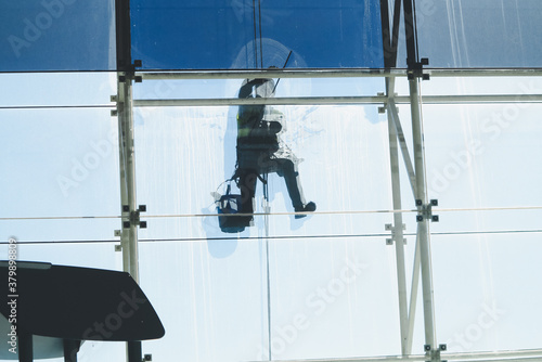 Window cleaner doing maintenance labors