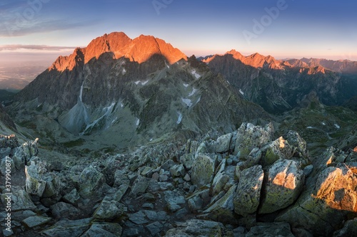 Fototapeta Naklejka Na Ścianę i Meble -  Scenic image of Fairytale mountains during sunset. The sunrise over a mountain in park High Tatras. Slovakia, Europe. Wonderful Autumn landscape. Picturesque view of nature Amazing natural Background