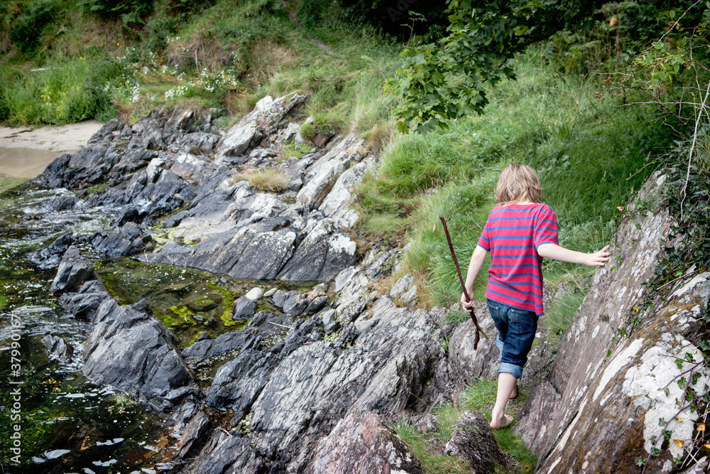 Climbing rocks by a river, Ireland Climbing rocks by a river, Ireland