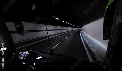 11,611 km long highway tunnel under the highest Apls mountain well known as Mont Blanc Tunnel. Inside the tourist bus windshield window view. photo