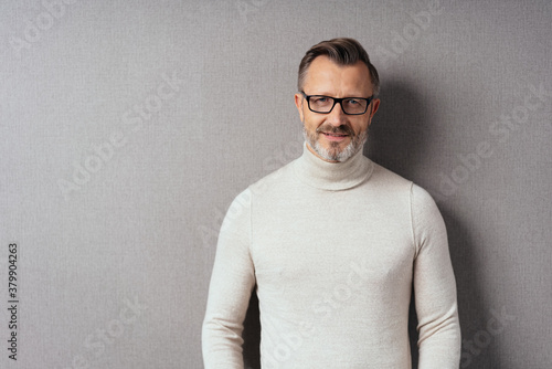 Portrait of middle-aged man in white turtleneck