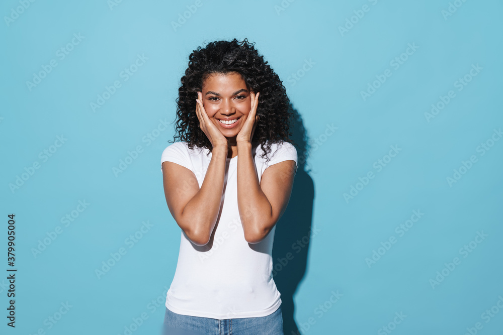 Image of happy african american girl smiling and looking at camera Image of happy african american girl smiling and looking at camera