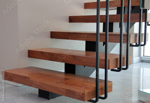 modern and decorative wrought iron, wooden staircase