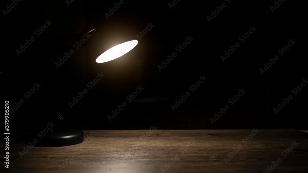 Lamp on desk at night, Free space for text. Lamp on desk at night, Free space for text.