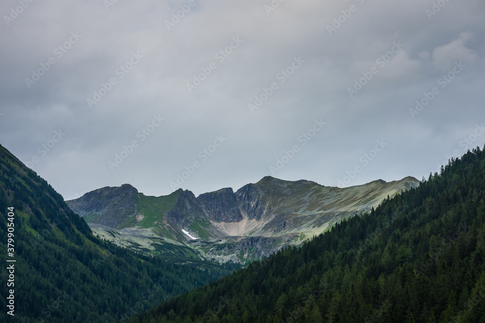 mountains with green hillsides while hiking