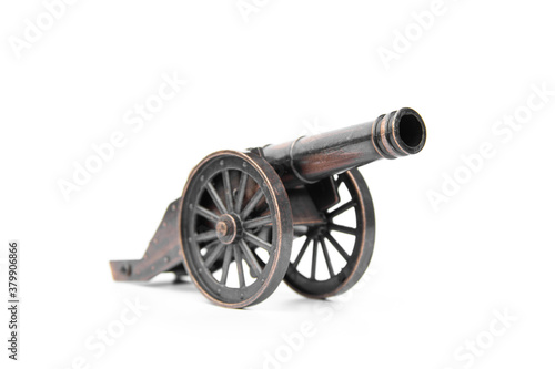 Ancient cannon on wheels isolated on white background.