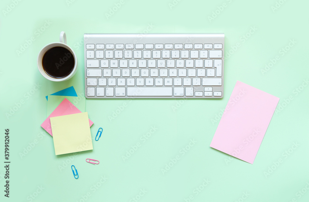 Blogger or freelancer flat workspace with keyboard, tablet, coffee and stationery on.light zellon background, view from the top. Place for text Blogger or freelancer flat workspace with keyboard, tablet, coffee and stationery on.light zellon background, view from the top. Place for text