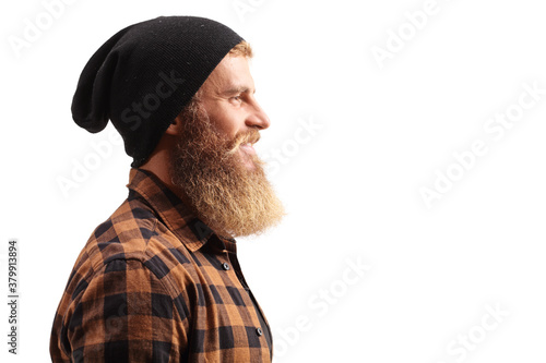 Close up profile shot of a hipster guy with beard and mustache wearing a black hat