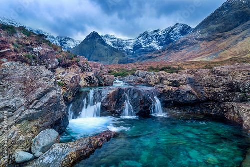 beautiful waterfalls Fairy Pools under the snowy mountains