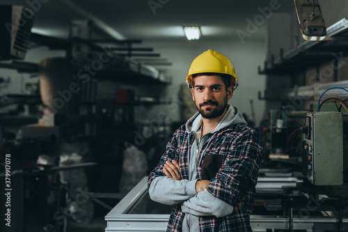 Aluminium and PVC industry worker standing crossed arms
