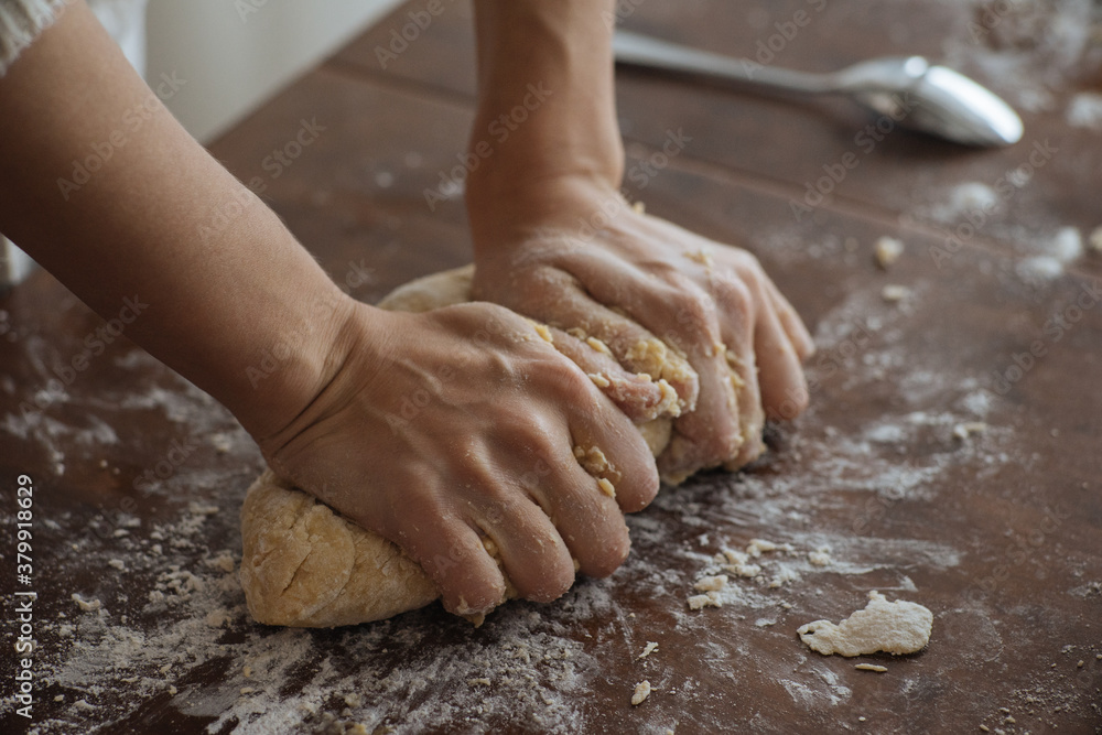 Hands of woman beating dough Hands of woman beating dough