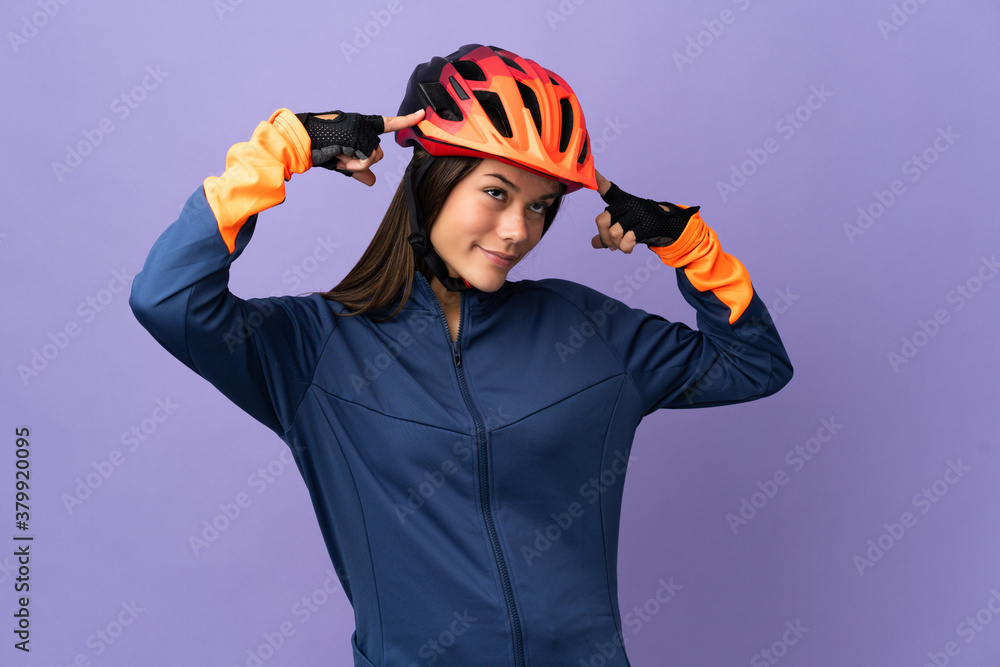 Teenager cyclist girl having doubts and thinking Teenager cyclist girl having doubts and thinking