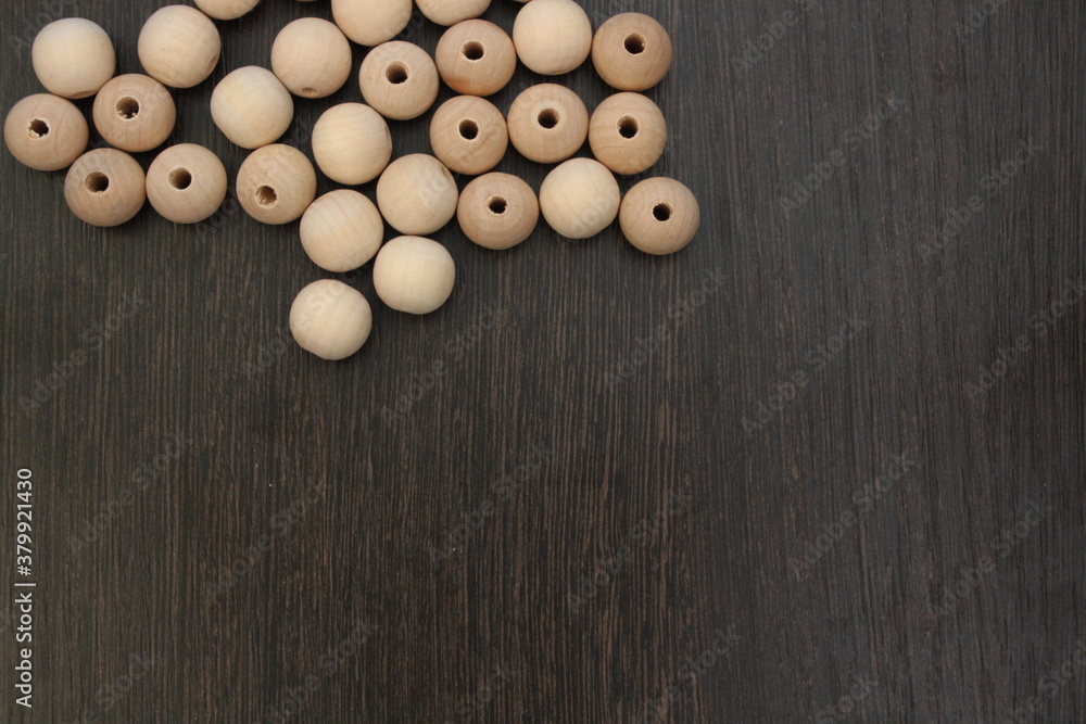 Wooden beads on the darck board