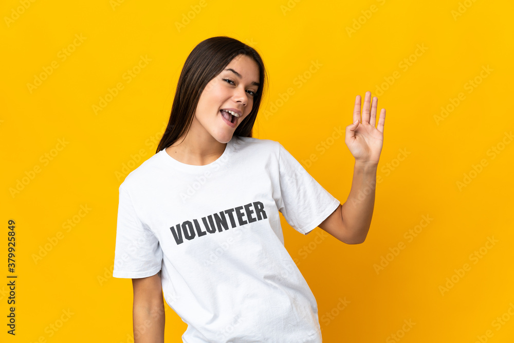 Teenager volunteer girl saluting with hand with happy expression Teenager volunteer girl saluting with hand with happy expression