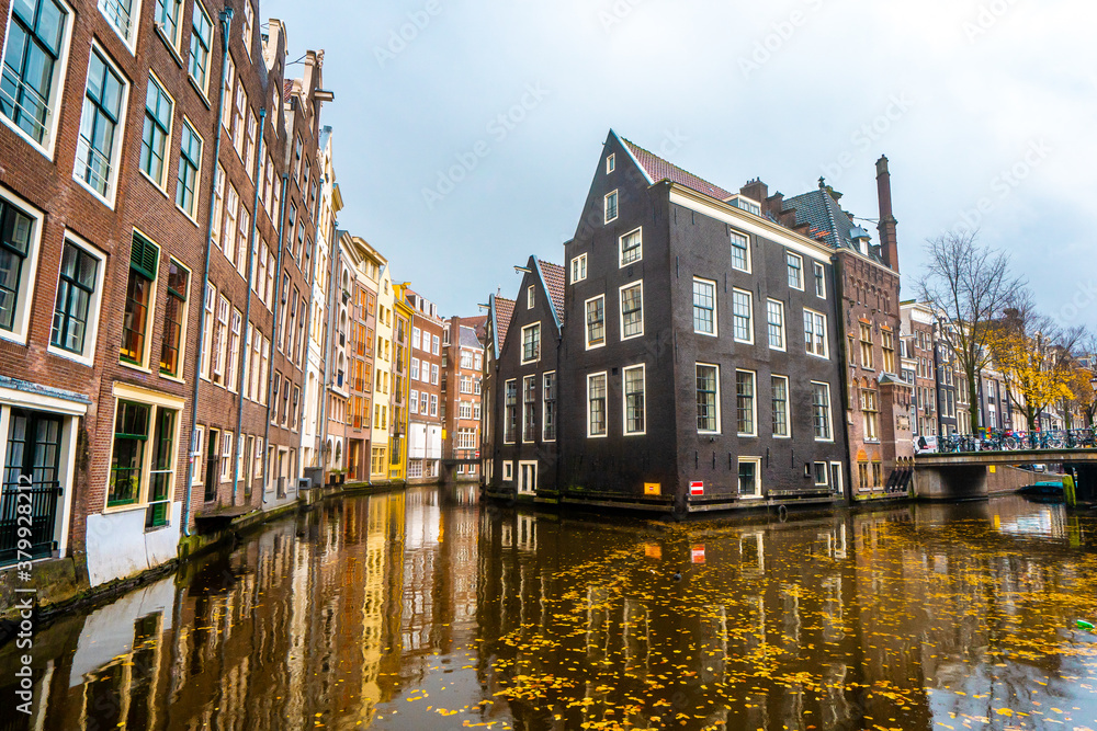 Beautiful building and canals near Red light and Damrak street  in Amsterdam , Netherlands
