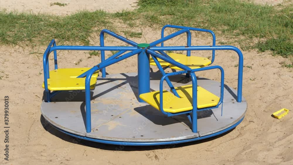 4K - Empty carousel spinning on the playground 4K - Empty carousel spinning on the playground