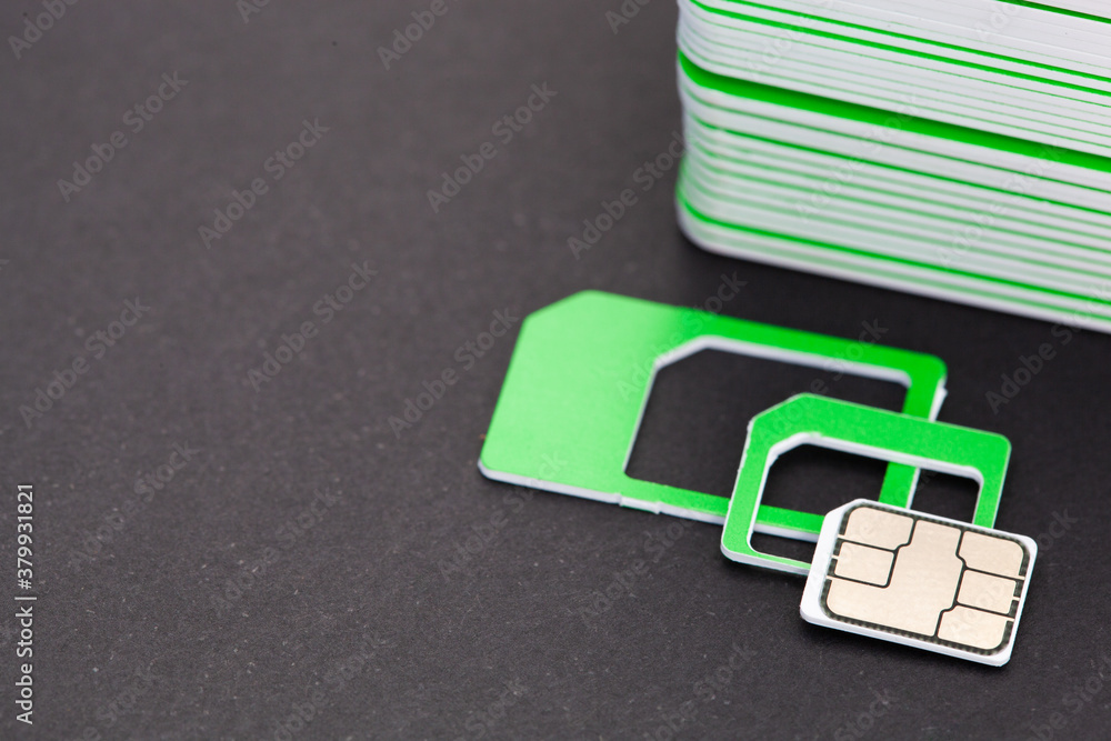 nano sim card extract from sim card adaptor on dark background nano sim card extract from sim card adaptor on dark background