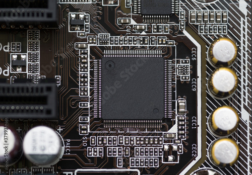 Close-up of electronic circuit brown board background of computer motherboard photo