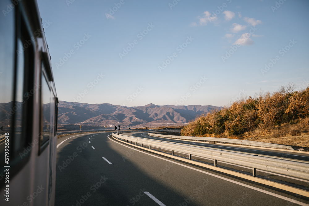 albanian highway with a mountain range in the back seen from a truck albanian highway with a mountain range in the back seen from a truck