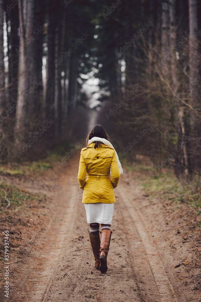 Woman walks into the forest Woman walks into the forest