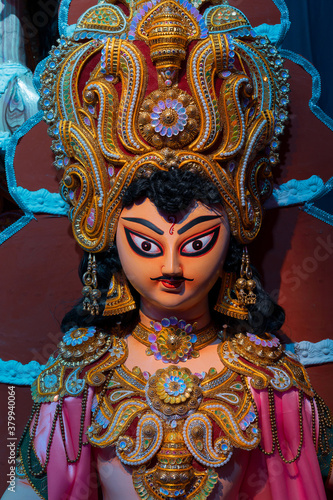God Kartik idol, decotaed during Durga Puja festival at night. Shot under colored light at Howrah, West Bengal, India. Biggest festival of Hinduism , celebrated all over the world. © mitrarudra