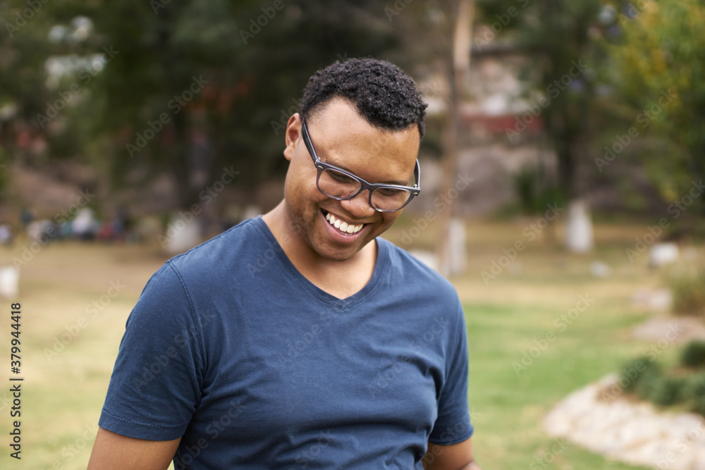 Handsome smiling man in a park Handsome smiling man in a park
