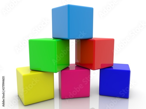 Six colored toy blocks are placed in a pyramid