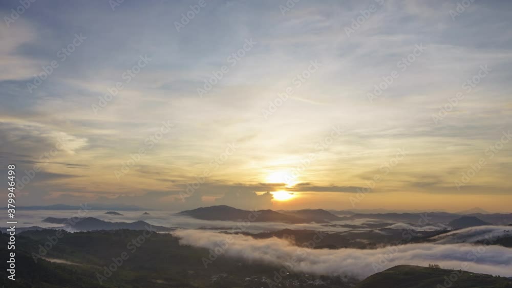 Beautiful morning sunrise time lapse and moving of clouds over the valley. Taken at RANAU PARAGLIDING PARK, SABAH BORNEO. time lapse motion tilt up Beautiful morning sunrise time lapse and moving of clouds over the valley. Taken at RANAU PARAGLIDING PARK, SABAH BORNEO. time lapse motion tilt up