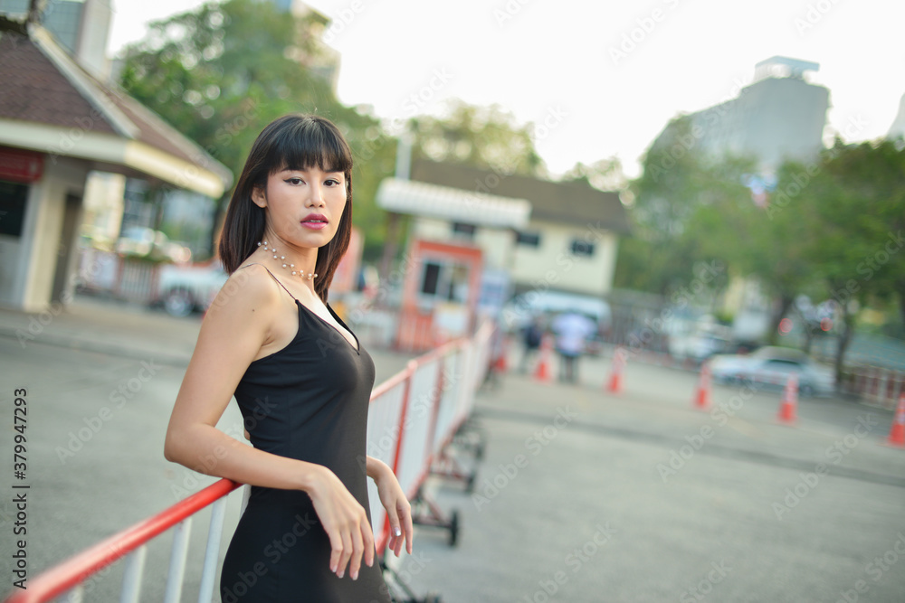 Fashion Asian businesswoman portrait of young pretty trendy girl posing at the city.