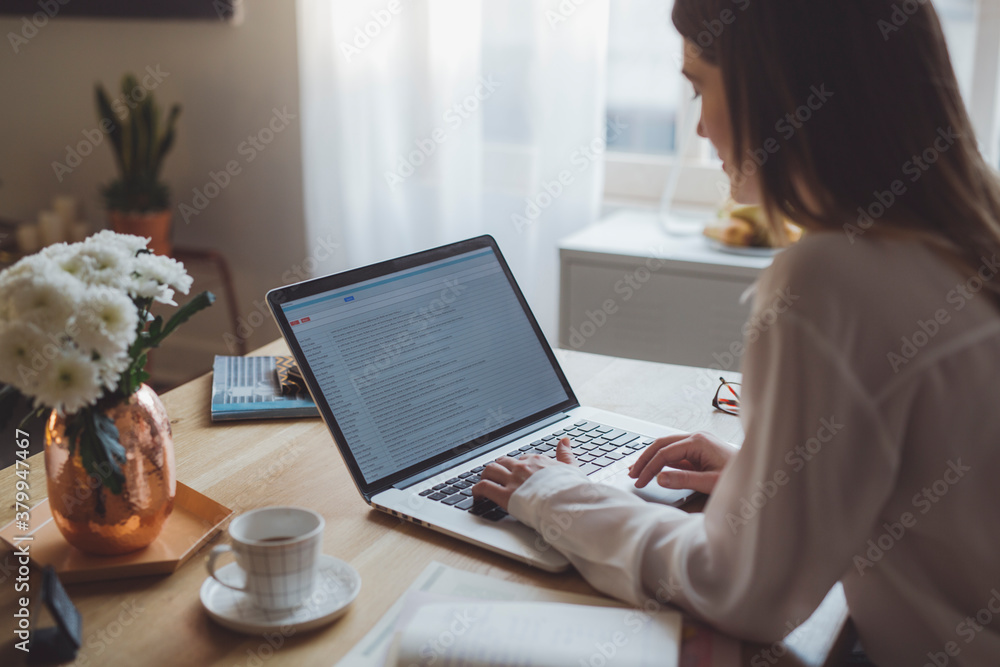 Businesswoman Typing on Her Laptop
