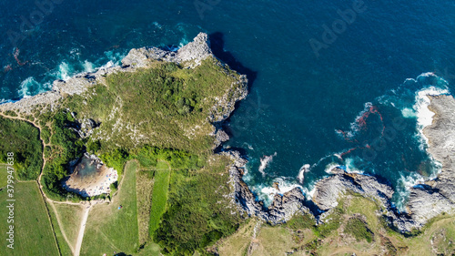playa de Gulpiyuri, gulpiyuri beach, llanes, Hontoria, Asturia, Spain, beach inside of the rock, high cliffs, cantabrian sea, tourists atraction, ocean, view from above, from air, made by drone